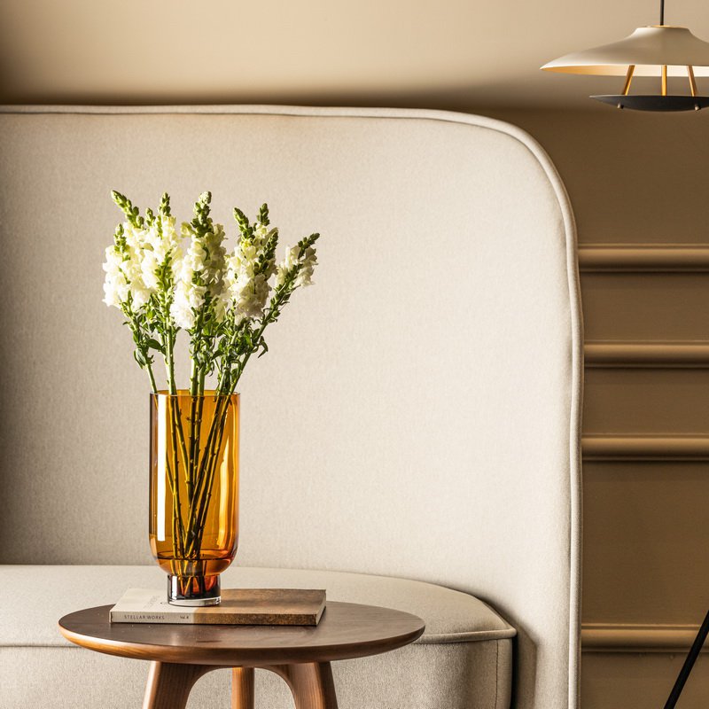 Sober modern tall glass vase, cylindrical shape on a solid base, warm dark orange, OMAHA18AM